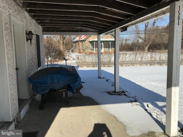 view of snow covered patio