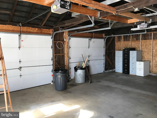 garage featuring a garage door opener