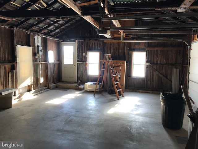 garage featuring wooden walls