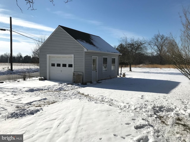 view of snow covered garage