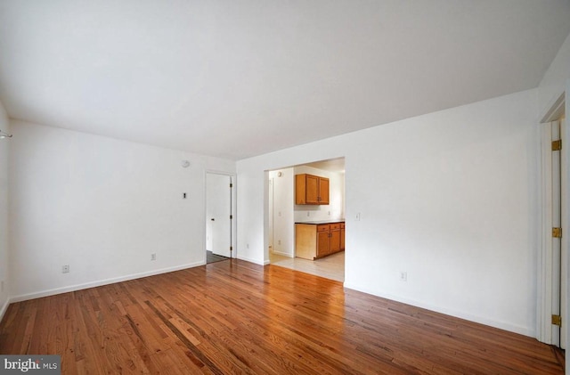 spare room featuring light hardwood / wood-style flooring