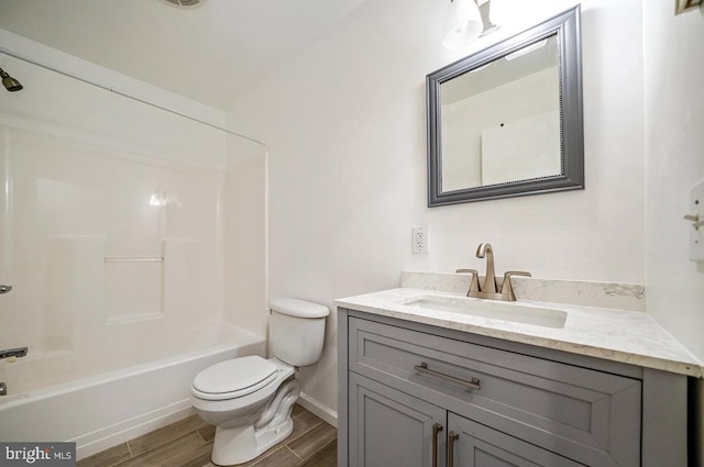 full bathroom with vanity, toilet, wood-type flooring, and bathtub / shower combination