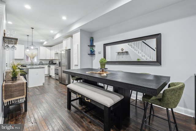 dining area featuring dark hardwood / wood-style flooring