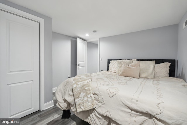 bedroom with hardwood / wood-style flooring