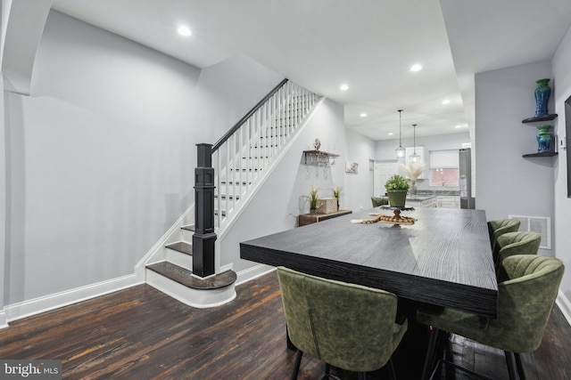 dining room featuring dark wood-type flooring