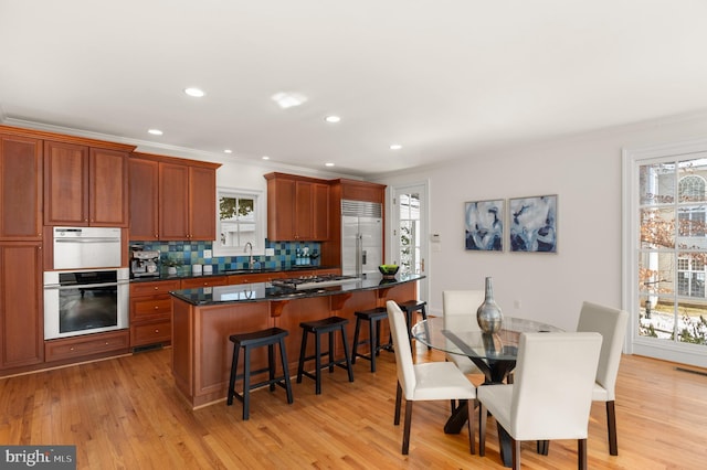 kitchen featuring appliances with stainless steel finishes, sink, and plenty of natural light