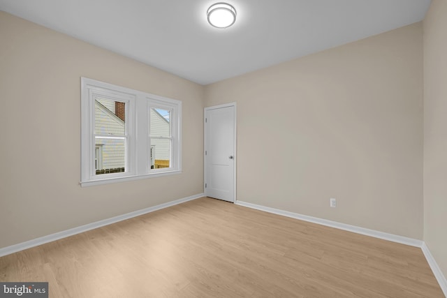 unfurnished room featuring light wood-type flooring