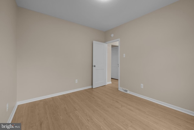 spare room featuring light hardwood / wood-style flooring