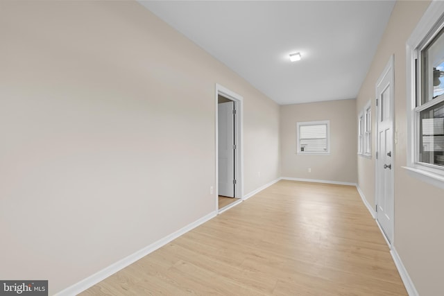 spare room with light hardwood / wood-style flooring