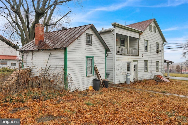 rear view of house with a balcony