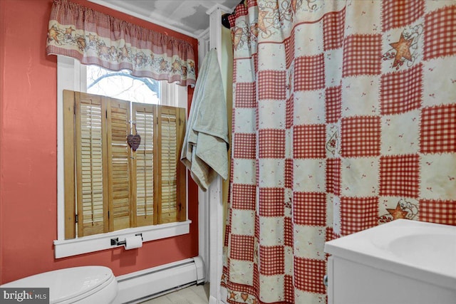 bathroom with toilet and a baseboard radiator