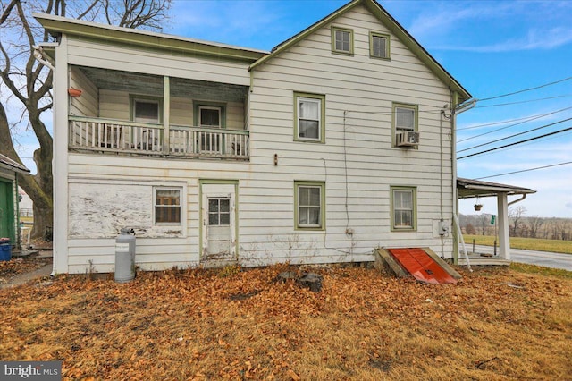 back of house with a balcony