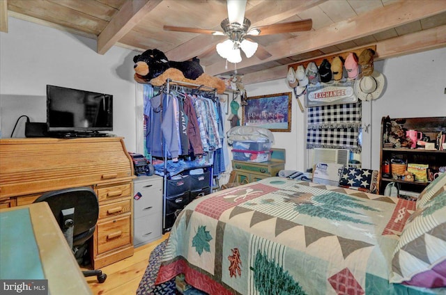 bedroom with ceiling fan, beam ceiling, wood-type flooring, and wooden ceiling