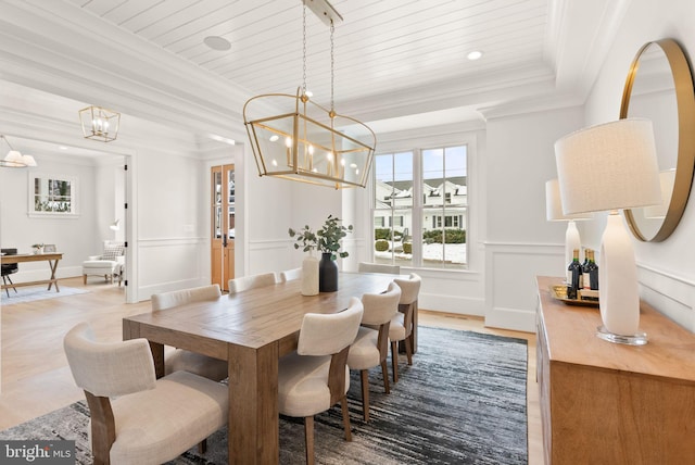 dining area featuring a raised ceiling, ornamental molding, wooden ceiling, and hardwood / wood-style flooring