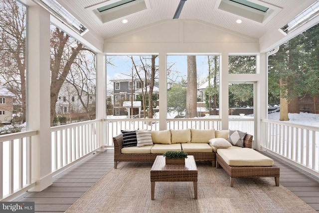 sunroom / solarium featuring vaulted ceiling