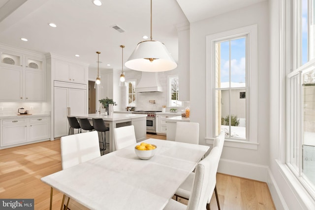 dining room with light hardwood / wood-style flooring