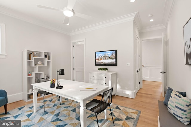 home office with ceiling fan, light hardwood / wood-style floors, and ornamental molding