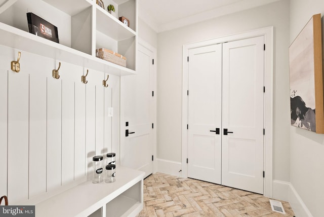 mudroom with light parquet flooring