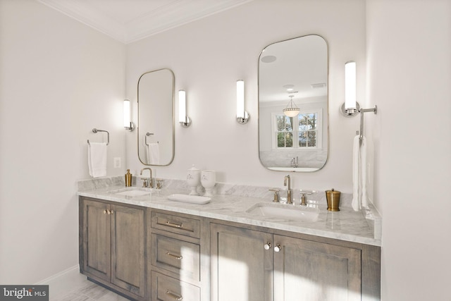 bathroom with crown molding and vanity