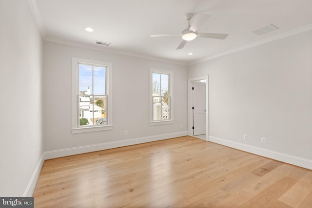 empty room with crown molding, ceiling fan, and light wood-type flooring