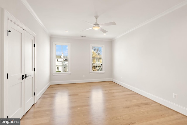 unfurnished bedroom with ceiling fan, light hardwood / wood-style floors, and ornamental molding