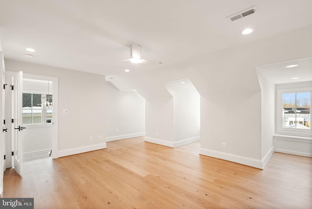 additional living space featuring ceiling fan, light hardwood / wood-style floors, and lofted ceiling