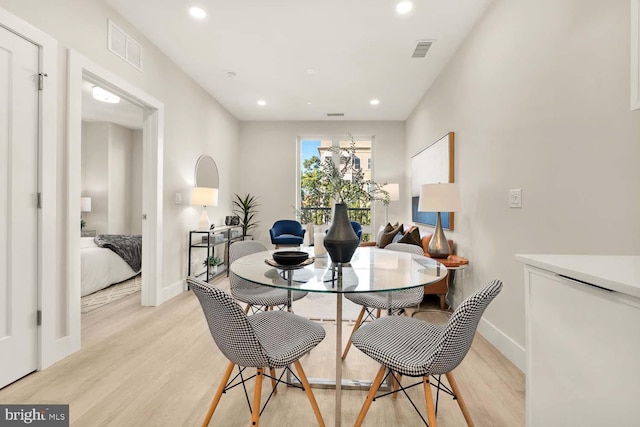 dining space featuring light hardwood / wood-style floors