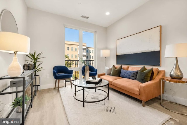 living room with light hardwood / wood-style flooring