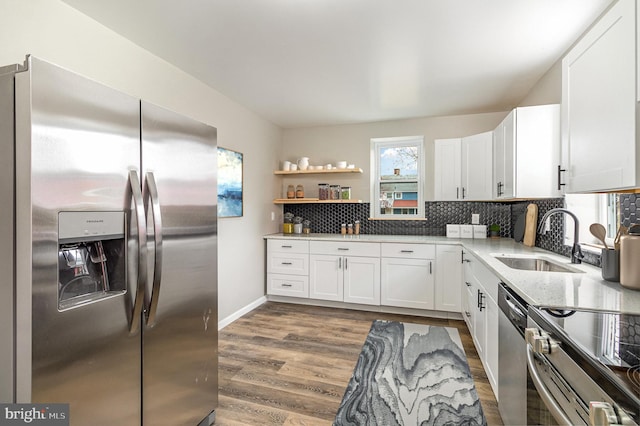 kitchen with white cabinetry and appliances with stainless steel finishes