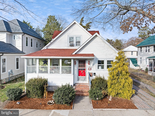 bungalow-style house featuring a sunroom