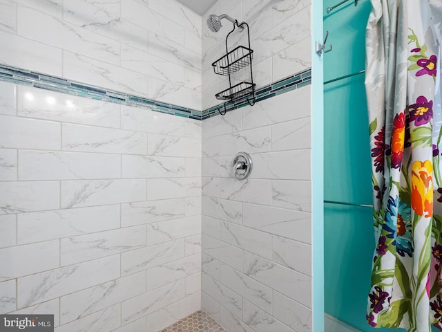 bathroom with a shower with shower curtain