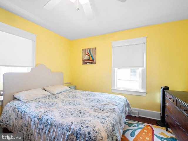 bedroom featuring hardwood / wood-style flooring and ceiling fan