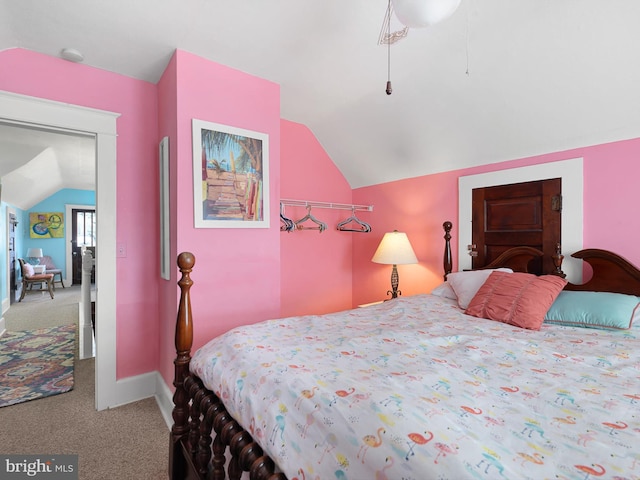 carpeted bedroom featuring vaulted ceiling