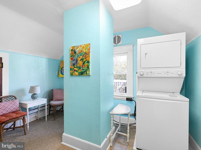 laundry room featuring stacked washer and dryer