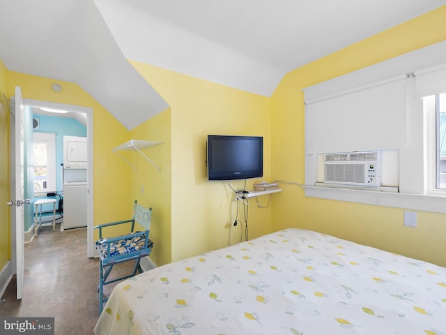 bedroom with refrigerator, cooling unit, multiple windows, and lofted ceiling