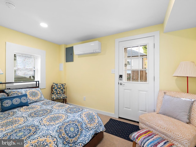 carpeted bedroom with electric panel and a wall unit AC