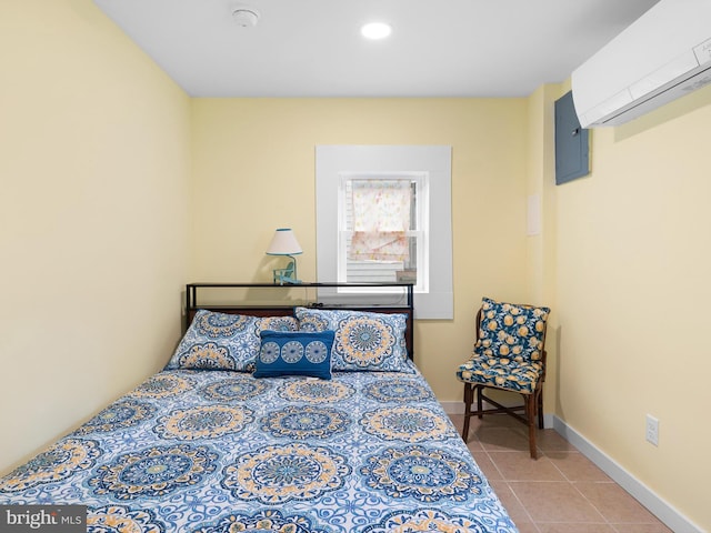 bedroom featuring light tile patterned floors and a wall mounted AC