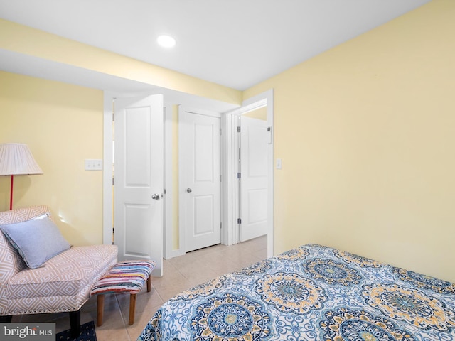 bedroom with light tile patterned floors