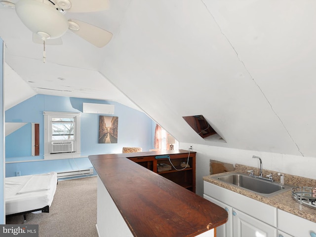 bar with sink, carpet, an AC wall unit, lofted ceiling, and white cabinets