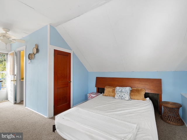 bedroom featuring ceiling fan, carpet, and lofted ceiling