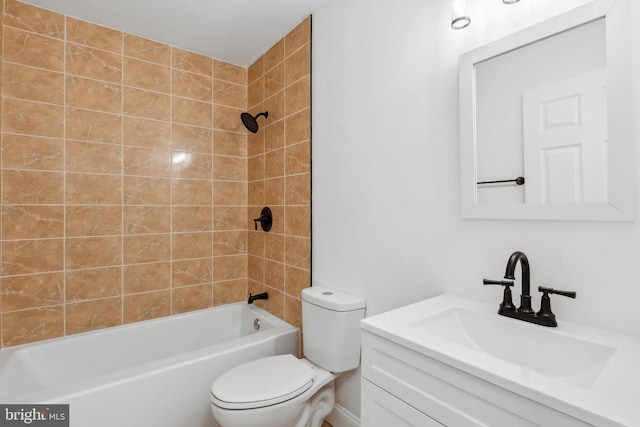 full bathroom with vanity, toilet, and tiled shower / bath