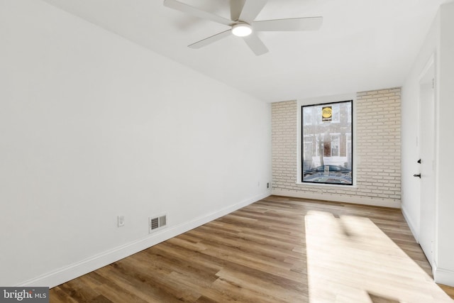 spare room featuring ceiling fan and light hardwood / wood-style flooring