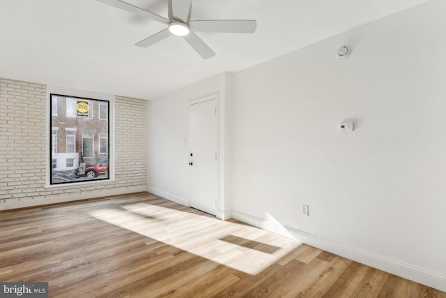 unfurnished room featuring light hardwood / wood-style flooring and ceiling fan