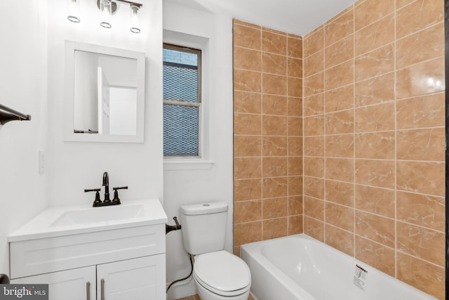 full bathroom featuring vanity, tiled shower / bath combo, and toilet