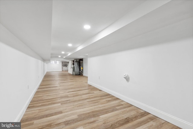 basement featuring light hardwood / wood-style flooring