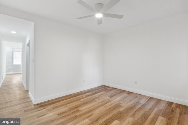 unfurnished room with light hardwood / wood-style flooring and ceiling fan