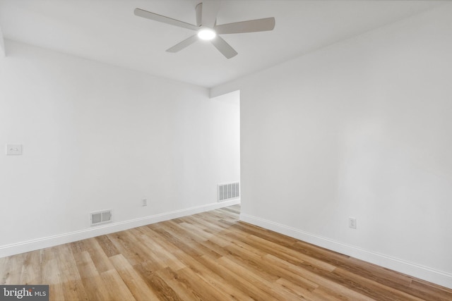 spare room featuring ceiling fan and light hardwood / wood-style floors