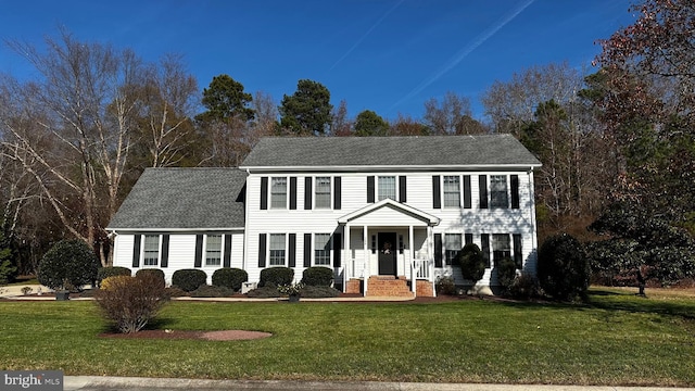 colonial-style house with a front yard