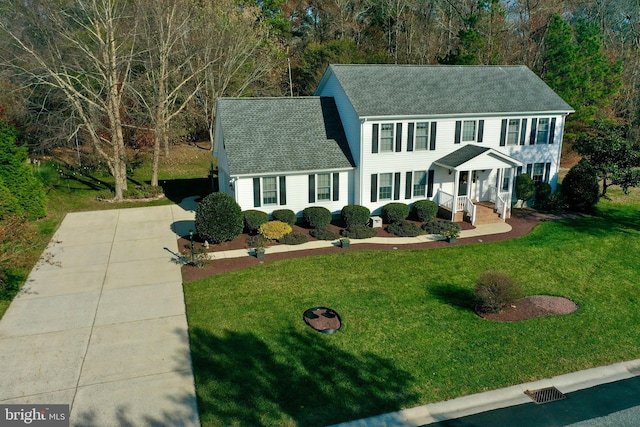 colonial inspired home with a front yard