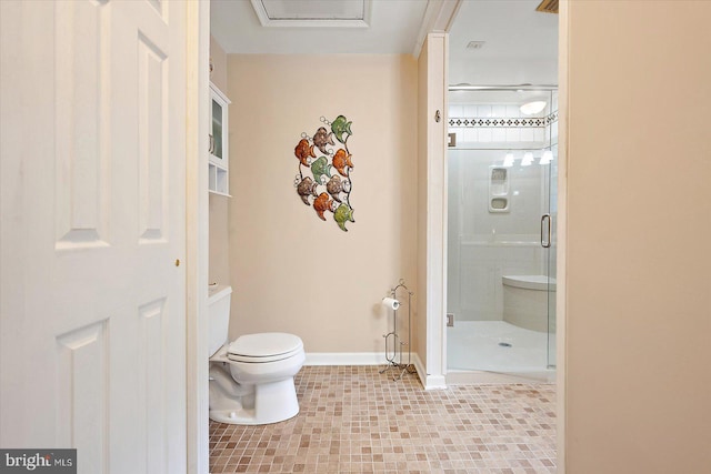 bathroom featuring tile patterned flooring, toilet, and a shower with shower door